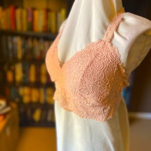 Two plus-size bralettes, pink and black